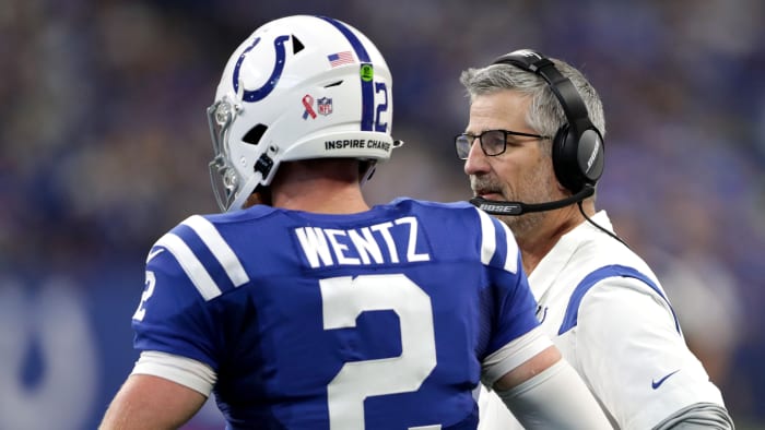 Indianapolis Colts quarterback Carson Wentz (2) talks with head coach Frank Reich on Sunday, Sept. 12, 2021, during the regular season opener against the Seattle Seahawks at Lucas Oil Stadium in Indianapolis